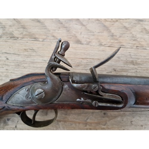 116 - A pair of reproduction flintlock pistols, 31cm barrel with ramrod below, touch hole is just an inden... 