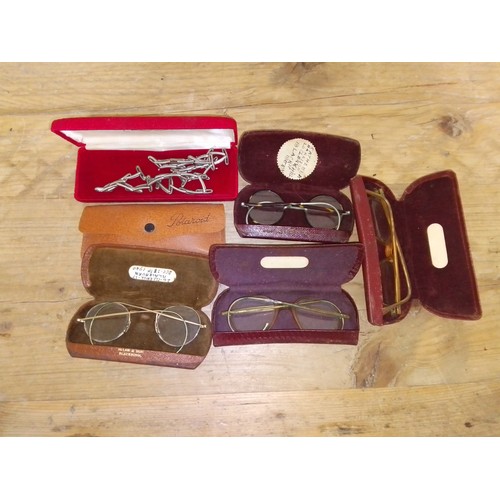 323 - Four pairs of vintage spectacles.