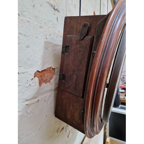 235 - A mahogany cased round fusee wall clock, signed 'Kimich Hemel Hempstead', diameter 41cm.