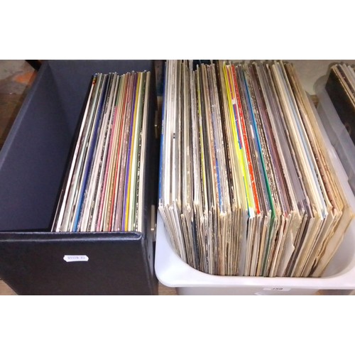 359 - A box of pop LPs and a case of assorted LPs.