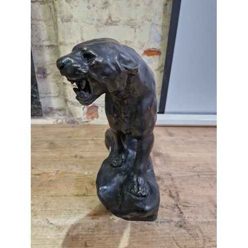 52 - A spelter tiger, signed 'T Cartier', length 50cm.