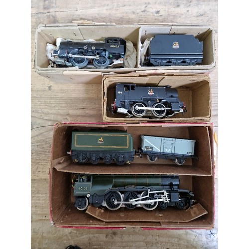 145 - A box of Trix Twin Railway items to include locos, rails, accessories and metal farmyard models etc.