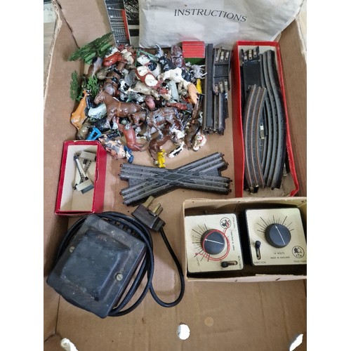 145 - A box of Trix Twin Railway items to include locos, rails, accessories and metal farmyard models etc.