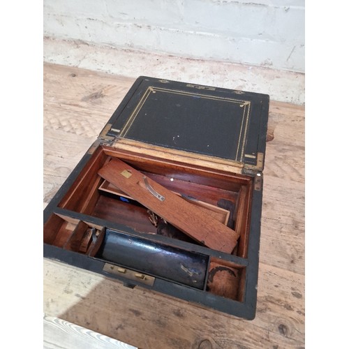 314 - A 19th century brass bound burr walnut writing slope.