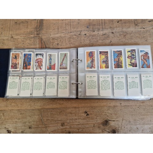 301 - Two albums of American themed collectors cards, cigarette cards including Red Indians, The Wild West... 