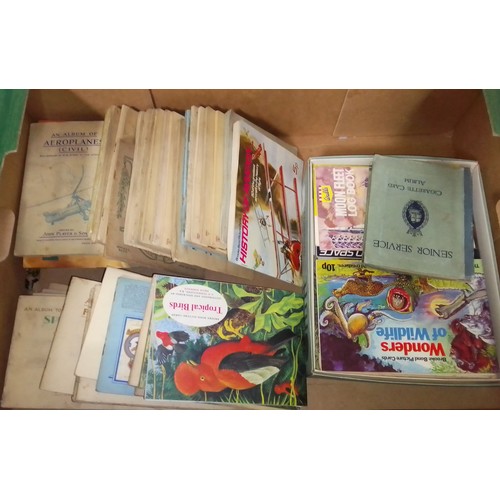 428 - A box of assorted cigarette card albums.