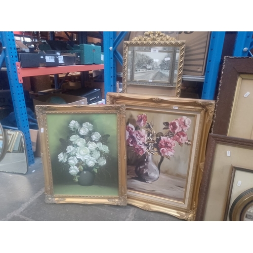 708 - Two gilt framed mirrors together with two still life oil paintings of flowers, one signed 'Suzanne',... 