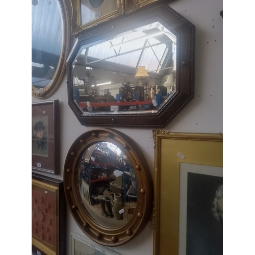 748 - A Regency style convex mirror and a 1930s oak framed mirror.