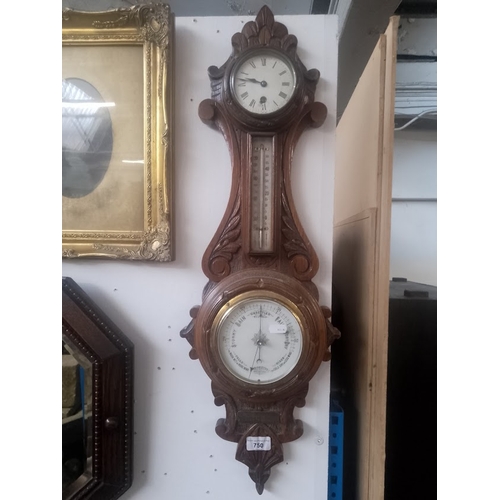 750 - A Victorian carved oak barometer with clock.