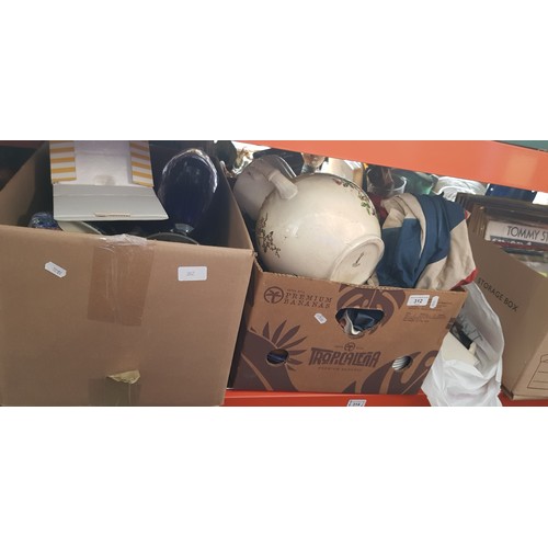 312 - 2 boxes and 1 bag of various items including ceramics, glassware, an old doll, Union flag, empty jew... 