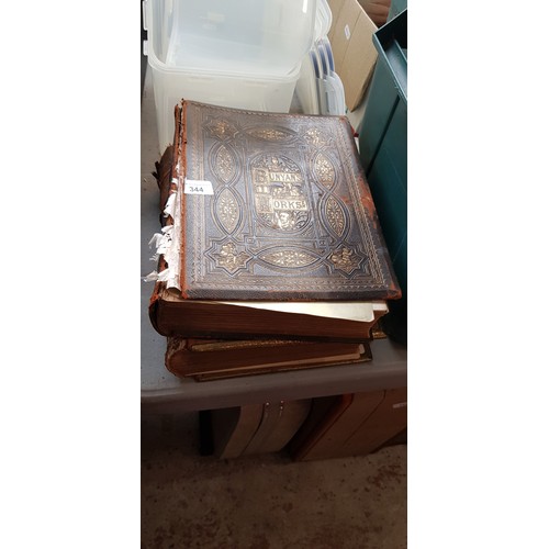 344 - Works of John Bunyan book and a family Bible.