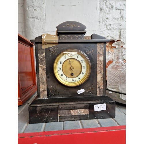 157 - A black slate mantel clock ( AF ) with key.