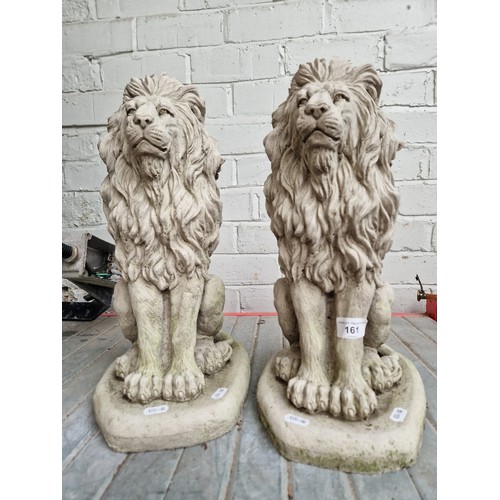 161 - A pair of stoneware lion garden ornaments.