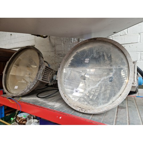 162 - A pair of large industrial Philips spotlights.