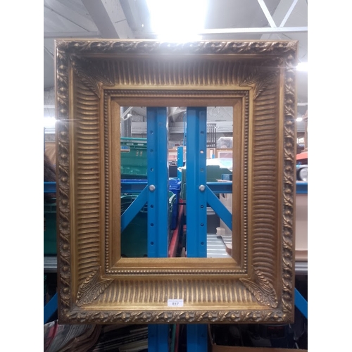 817 - A heavy 20th century gilt frame, 57cm x 67.5cm, aperture 29cm x 39cm, recess 30.5cm x 40.5cm.