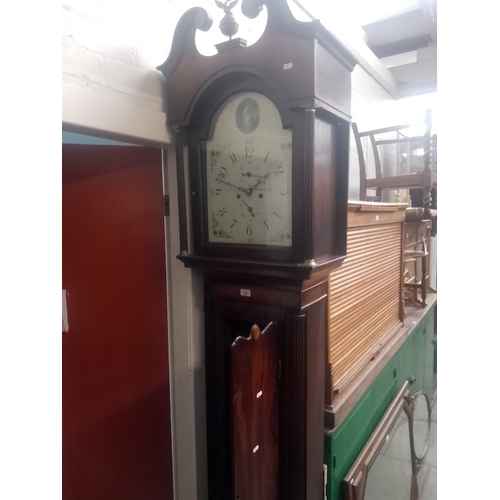 829 - A George III eight day mahogany long case clock with weights and pendulum, quarter columns to the ca... 