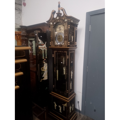 834 - A Chinese black lacquer and gilt decorated eight day long case clock with weights and pendulum.