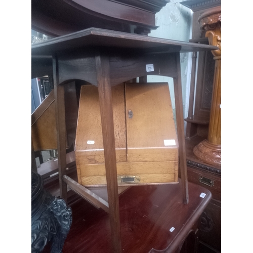 839 - A Victorian oak desk tidy together with an Edwardian oak occasional table.