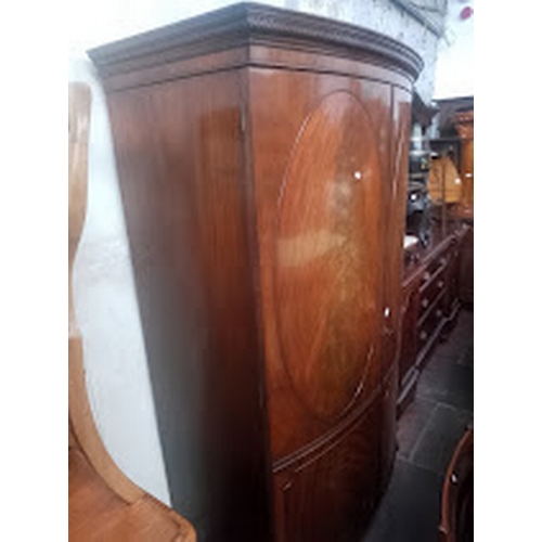 842 - A 19th century mahogany bow front wardrobe.