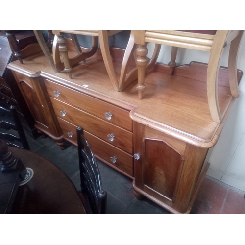 843 - A Victorian mahogany sideboard with pressed glass handles.