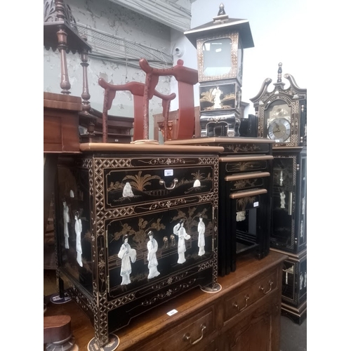 861 - Three pieces of Chinese black lacquer and gilt decorated furniture; side cabinet, nest of tables and... 