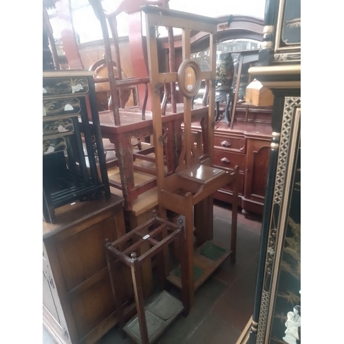 862 - An early 20th century oak hallstand together with an oak stick stand.