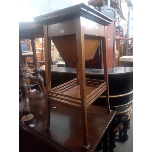 871 - An early 20th century oak sewing table.