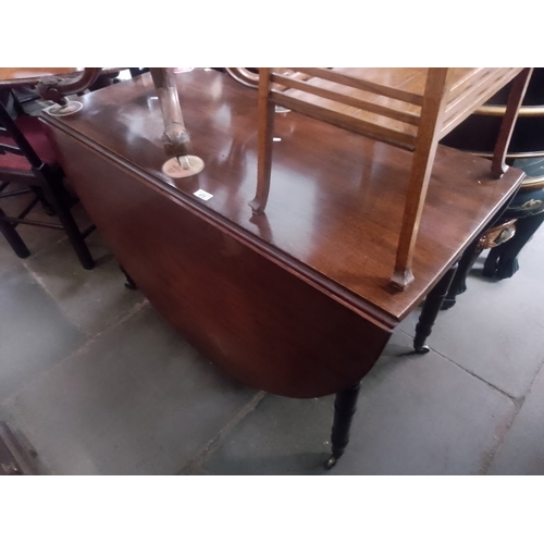 872 - A 19th century mahogany drop leaf table.