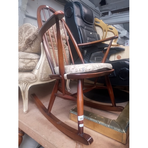 880 - A vintage Ercol rocking chair.