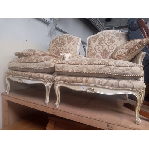 882 - A pair of French style armchairs.