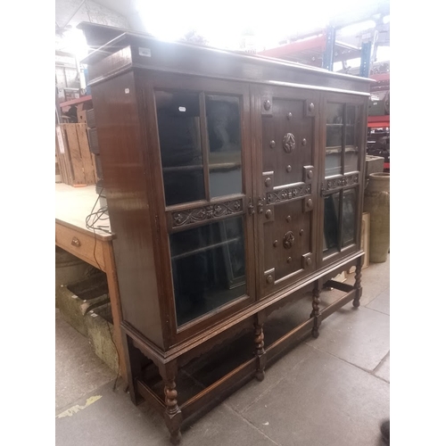 888 - A 1920s oak bookcase/cabinet.