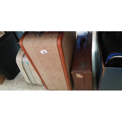 348 - 3 vintage suitcases and a vintage dress.