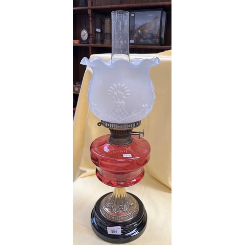 554 - A ruby glass oil lamp