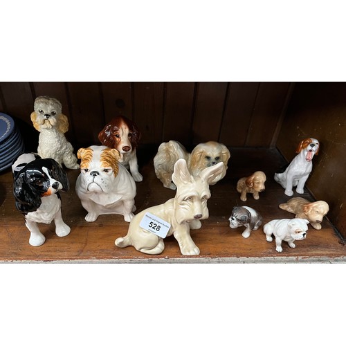 528 - 11 dogs including a Sylvac apricot poodle and other Sylvac, Beswick, Royal Doulton etc.