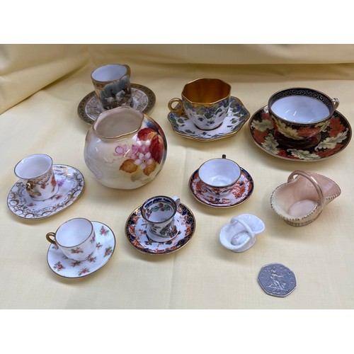 553 - 7 miniature cups and saucers including Coalport, Spode, Royal Crown Derby, Masons, together with a r... 