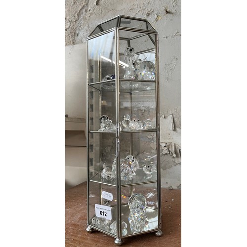 612 - A hexagonal display case containing Swarovski style crystal figures