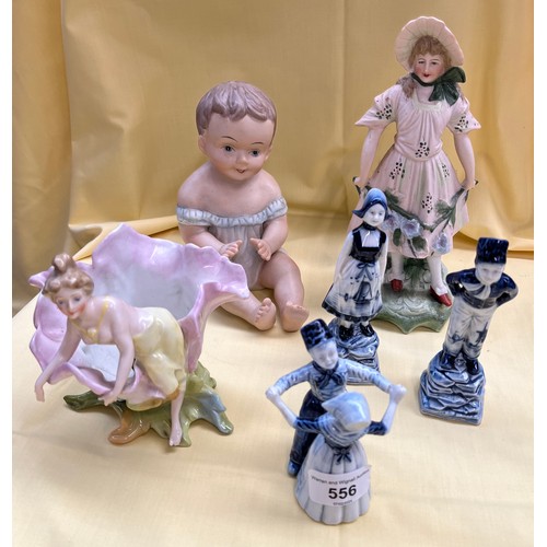 556 - 3 Delft figures, boys and girls together with 3 other continental pottery figures