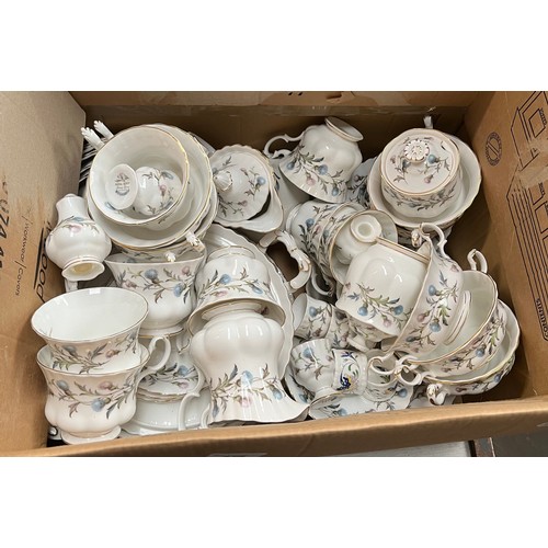 676 - A box containing Royal Albert Brigadoon tea wares - over 50 pieces