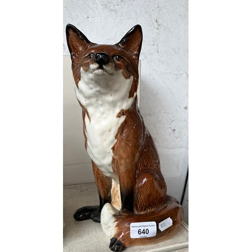 640 - A large figure of a seated fox by Beswick - height appx 32cm