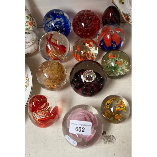 602 - 12 glass paperweights