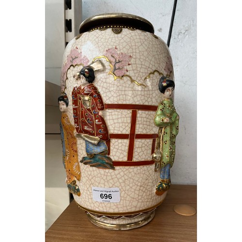 696 - A crackle glazed Japanese vase with applied oriental characters to outside