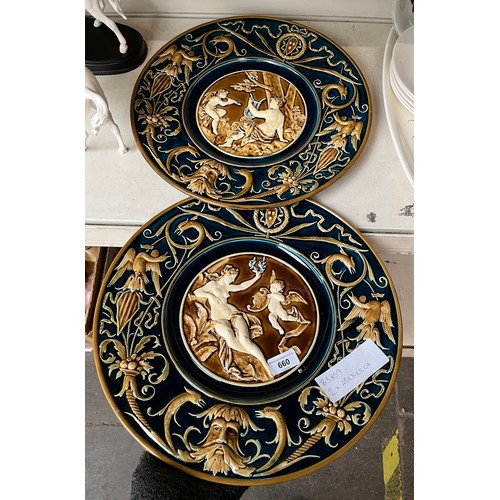 660 - Two large Majolica platters featuring classical figures on blue and brown ground. Diameter appx 39.5... 