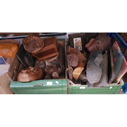 396 - Two boxes of tribal treen, wooden items, carvings, etc.