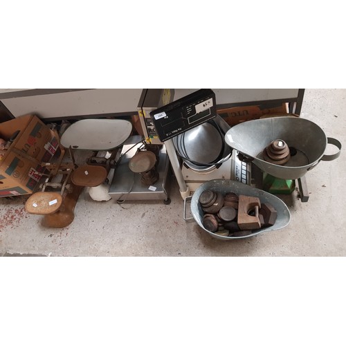 388 - A collection of vintage weighing scales and weights together with two electric shop scales.