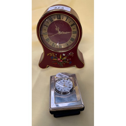 473 - A hallmarked silver clock and a swiss Petite Neuch Teloise clock.