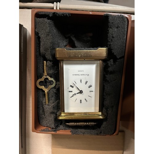 411 - A boxed Mathew Norman brass carriage clock.