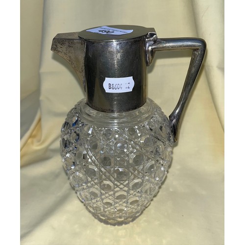 490 - A silver plated and cut glass claret jug in the manner of Christopher Dresser.