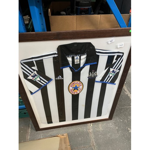 702 - A framed Newcastle United home shirt by Adidas season 1999-2000(unsigned).