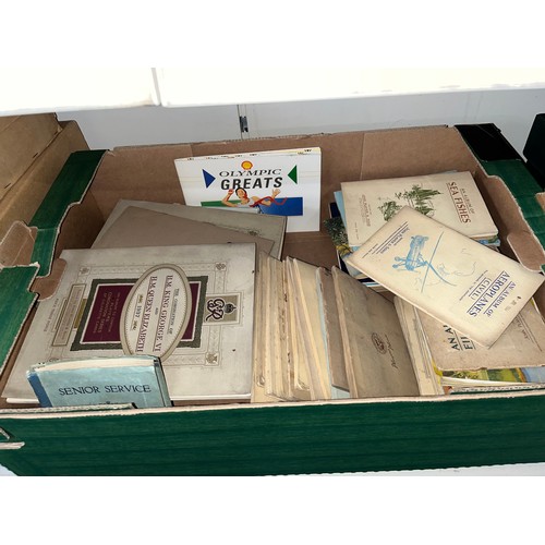 428 - A box of assorted cigarette card albums.