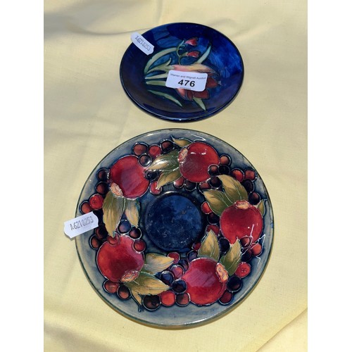 476 - A Moorcroft pin dish, diam appx 12cm, and a Moorcroft saucer diam 14cm.